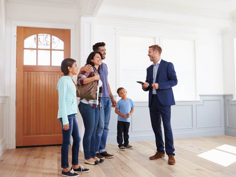 real estate agent showing a home for sale