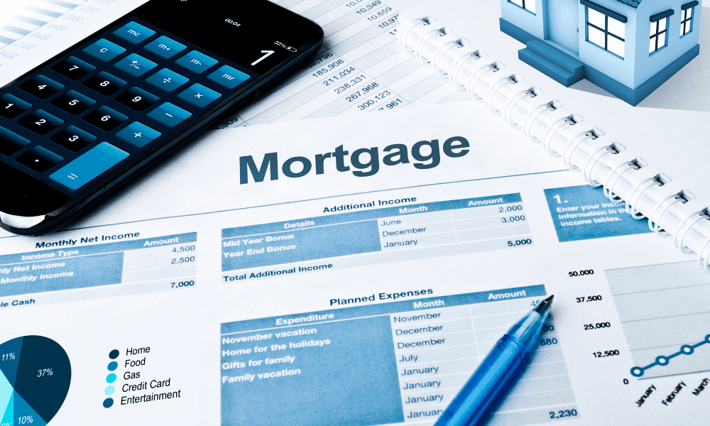 A cluttered desk with a document that says mortgage